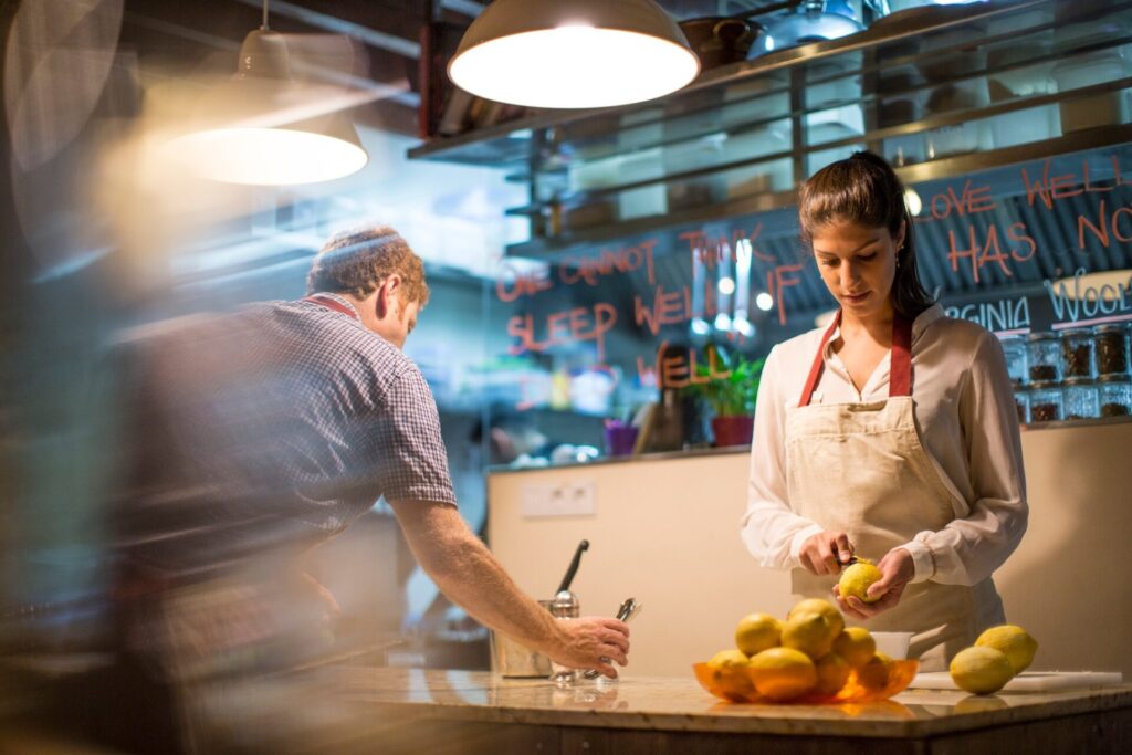 Restaurant owners working in kitchen