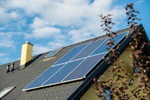 New ecologic house with solar panels Alternative to conventional energy. The battery is charged from