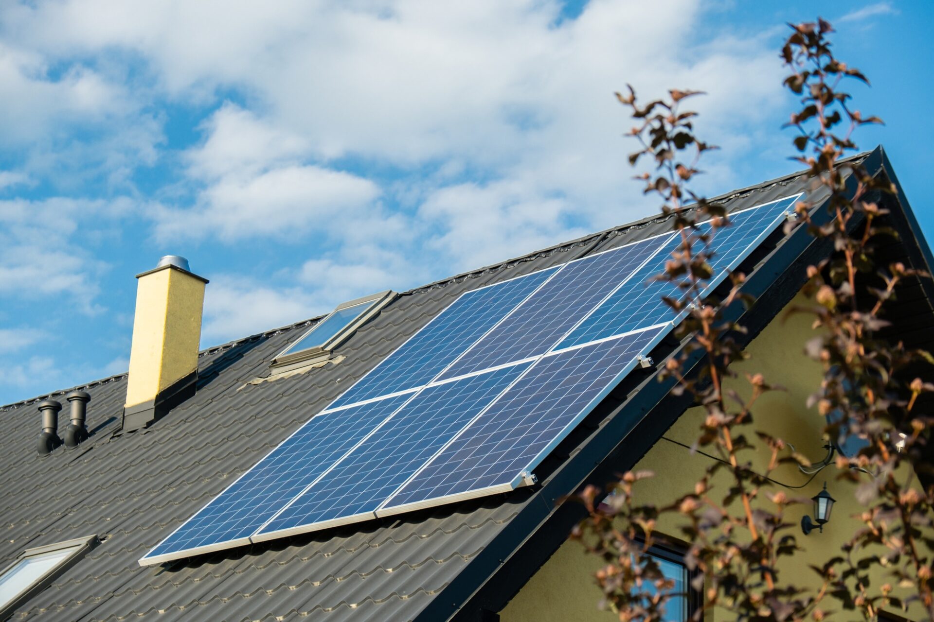 New ecologic house with solar panels Alternative to conventional energy. The battery is charged from